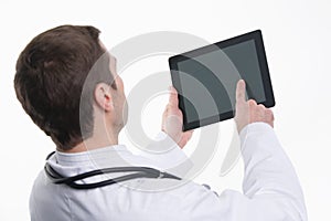 Medical doctor using tablet pc with empty screen