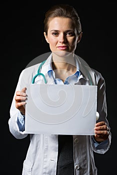 Medical doctor woman showing blank billboard