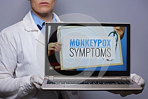 Medical doctor woman showing laptop with monkeypox symptoms