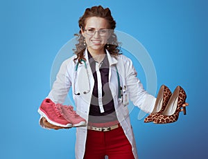 Medical doctor woman showing sneakers and high heel shoes