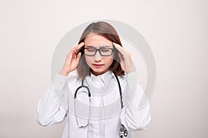 Medical doctor woman with stethoscope problem, hold hand head on white background