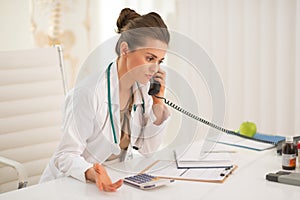 Medical doctor woman talking phone