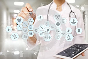 Medical doctor working with modern computer virtual screen interface. Medicine technology and healthcare concept.