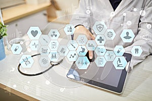 Medical doctor working with modern computer virtual screen interface. Medicine technology and healthcare concept.