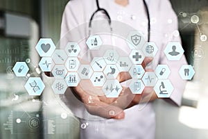 Medical doctor working with modern computer virtual screen interface. Medicine technology and healthcare concept.