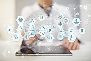 Medical doctor working with modern computer virtual screen interface. Medicine technology and healthcare concept.