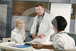 Medical doctors discussing diagnosis photo