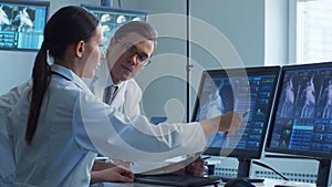 Medical doctors working in hospital office making computer research. Medicine, healthcare and technology concept.