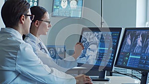 Medical doctors working in hospital office making computer research. Medicine, healthcare and technology concept.