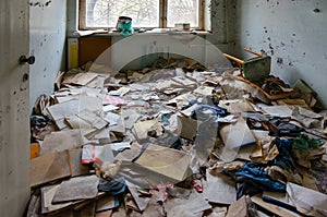 Medical documentation on floor in hospital, dead abandoned ghost town Pripyat in Chernobyl NPP alienation zone, Ukraine