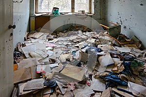 Medical documentation on floor in hospital, dead abandoned ghost town Pripyat in Chernobyl NPP alienation zone, Ukraine photo