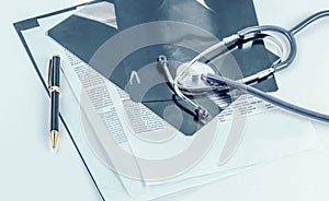 Medical documents of fluorography with pen and stethoscope the t