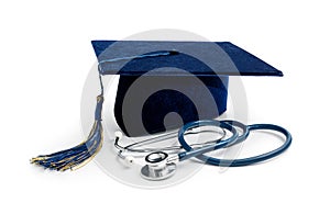 Medical education - college graduation cap and stethoscope on white background photo