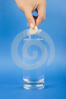 Medical - Effervescent tablet over the glass of water photo