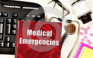 Medical emergencies. Text label on the reference book.