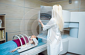 Medical equipment. Doctor and patient in MRI room