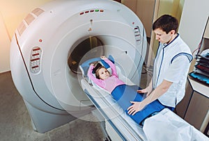 Medical equipment. Doctor and patient in the room of computed tomography