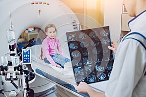 Medical equipment. Doctor and patient in the room of computed tomography