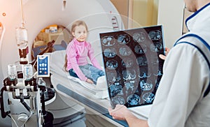 Medical equipment. Doctor and patient in the room of computed tomography