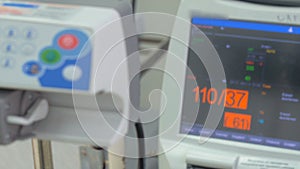 Medical equipment, monitor display in intensive care unit. Slider shot.