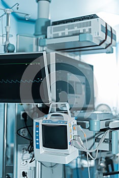 medical equipment with screens in surgery room