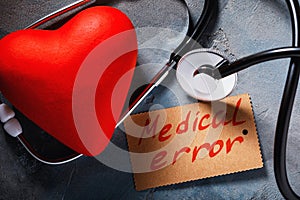 Medical error concept: stethoscope and heart shaped object