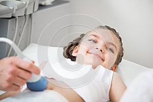 Medical exam little girl by ultrasound equipment