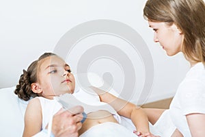 Medical exam little girl by ultrasound equipment