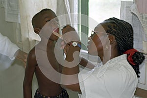 Medical examination at a boy by a female doctor