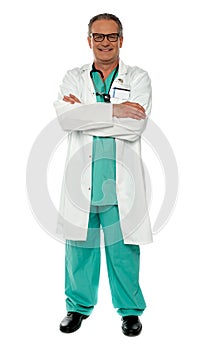 Medical expert standing with arms crossed