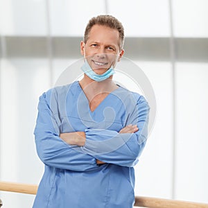 Medical expertise you can trust. Confident mature doctor in blue