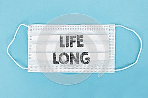 Medical face mask with LIFE LONG text on blue background