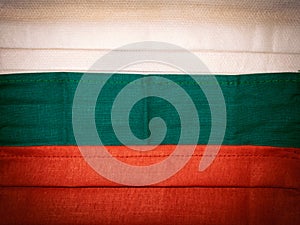 Medical facial masks close up formed Bulgarian flag.