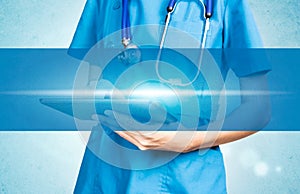 Medical female doctor using tablet background of visual display