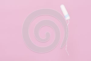 Medical female flyeng tampon on a pink background. Hygienic white tampon for women.Tampons on a pink background