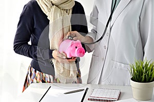 Medical financial check up with a stethoscope, Money savings for healthcare treatment.