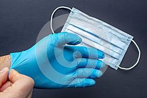 A medical first responder wearing gloves and face mask photo