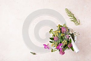 Medical flowers herbs in mortar. clover milfoil tansy rosebay