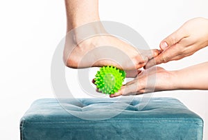 Medical foot massager. Removal of fatigue on the legs, relaxation. Home physiotherapy. Close-up