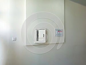 Medical Gas Shut-Off Valve and Gas Alarm Panels on White Wall with Light Switch On and Off