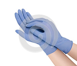 Medical gloves.Two blue surgical gloves isolated on white background with hands. Rubber glove manufacturing, human hand