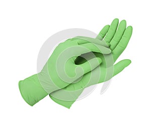 Medical gloves. Two green surgical gloves isolated on white background with hands. Rubber glove manufacturing, human