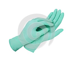Medical gloves. Two green surgical gloves isolated on white background with hands. Rubber glove manufacturing, human