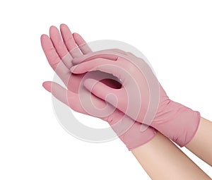 Medical gloves. Two pink surgical gloves isolated on white background with hands. Rubber glove manufacturing, human hand