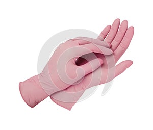 Medical gloves. Two pink surgical gloves isolated on white background with hands. Rubber glove manufacturing, human hand