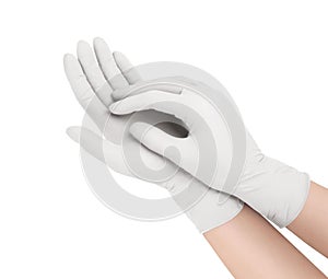 Medical gloves. Two white surgical gloves isolated on white background with hands. Rubber glove manufacturing, human