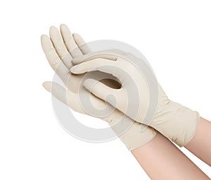 Medical gloves. Two white surgical gloves isolated on white background with hands. Rubber glove manufacturing, human