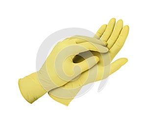 Medical gloves. Two yellow surgical gloves isolated on white background with hands. Rubber glove manufacturing, human