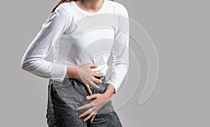 Medical or gynecological problems, healthcare concept. Close up of a woman with hands holding her crotch. Woman Hands