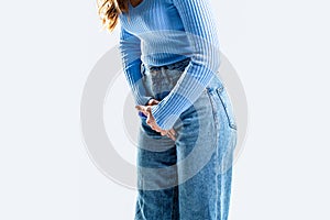 Medical or gynecological problems, healthcare concept. Closeup woman hands holding her crotch. Woman hands holding her